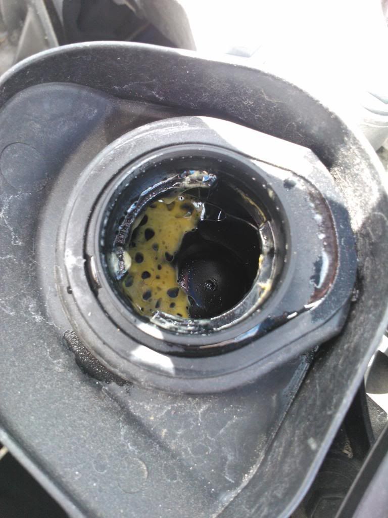Weird 'gunk' under engine oil filler cap on Clio. Is it normal